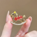 Golden rocking horse brooch with red accents and shimmering clear rhinestones inlay - 828# Get Rich Instantly