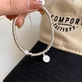 Silver-plated handmade bracelet with white pearl and heart-shaped pendant detail - Heart Wound Artificial Pearl (SL0937)