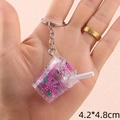 Close-up of a 4.2x4.8cm strawberry ice drink keychain with realistic resin details - Purple