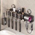 Grey suction cup bathroom rack with 4 cups, toothbrush slots and hairdryer holder - 4-Person · Solid Cup + Dispenser