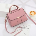 Pink minimalist crossbody handbag with a gold semi-circle metal handle and a matching strap - Pink