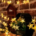Solar powered star shaped LED string lights with warm yellow frosted star bulbs - Romantic Little Star (warm Colors)