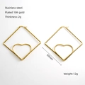 Detail of 50mm 18K gold plated stainless steel diamond hoop earrings with heart design - Large / Gold