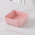 Minimalist square pink ceramic snack bowl with smooth finish on marble background - Pink