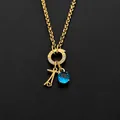 Stainless steel necklace with 14K gold finish featuring a blue crystal and key charm - Letter T