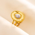 Detailed shot of gold-plated ring with white marble stone and hammered texture detail - Gold-White (Marble Texture)