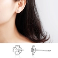 Minimalist S999 sterling silver four-leaf clover stud earrings with hollow heart shapes - Hollow Clover Studs