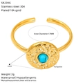 Macro shot of 18K gold-plated stainless steel ring with turquoise and hammered texture - Hammered Disc Turquoise Style (SR239G)