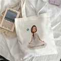 White canvas tote bag featuring a peaceful meditation print on a soft fabric surface - Meditating Figure Pattern
