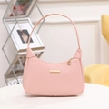 Pink crescent shoulder bag with lychee grain texture and elegant gold hardware - Pink