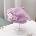 Lavender knitted baby beret featuring small decorative flowers on a white display stand - Double Flower Knit Beret / Purple