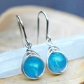 Minimalist wire-wrapped silver drop earring featuring a round blue gemstone bead - Blue