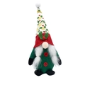 Detail of a Christmas gnome with a patterned pointed hat and fluffy white beard - Female Style