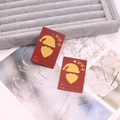 Detail of red Christmas gift tags with gold Santa silhouette and Ho Ho Ho text on velvet - Red No.2 (Santa Claus)