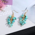 Detail of bohemian turquoise stone tassel earrings with elegant gold multi-layered chains - Gold Hook Style / Turquoise Stone