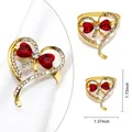 Golden heart napkin ring with red crystal bow and rhinestones on a white napkin - Heart Bow Rhinestone