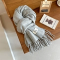 Thick grey knitted wool scarf with fringe tassels and woven label on wooden surface - 40 Sea Blue / Over 175cm