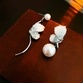 Detail of asymmetric silver butterfly earring with pearls and zircons on leather - Half Butterfly Crystal Artificial Pearl (15# Silver Earring Post)