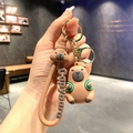 Cute brown silicone Capybara keychain with embossed wrist strap and golden clasp - B56-2 Green Bag