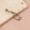 Macro view of silver adjustable box chain ring with pink round zircon stone - Steel