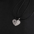 Couples' stainless steel heart puzzle necklace set in black and silver with love engraving - Pendant Pair + Leather Rope