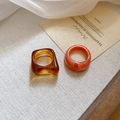 Detail of amber square and pink marble round acrylic rings set on linen - Coffee/Amber (2-Piece Set)
