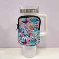 Detailed close-up of a floral neoprene pouch attached to a white 40oz tumbler - No. 3 Green Flower