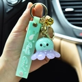 Cute resin octopus keychain with light-up feature for car and backpack decoration. - Green