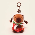 Brown Capybara plush keychain wearing red strawberry cloak and a green scarf - Traditional Padded Jacket Style