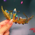 Macro detail of rainbow crystal headband with gold wings and crescent moon charm - Multicolor Crystal + Gold Wing Moon