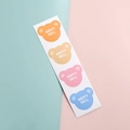 Cute bear-shaped Happy Mail stickers in four colors on a pastel blue and pink background - Bear