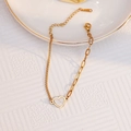 Elegant 18K gold heart pendant bracelet with asymmetrical curb and oval link chain - Gold Heart Bracelet