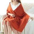 Fashionable orange plaid scarf with soft fringe details worn in a cozy home setting - Orange Red