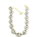 Detail of silver oval bean link chain with golden extender and lobster clasp closure - Silver