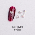 Macro detail of 6x5mm heart-shaped nail charms with silver base and AB rhinestones - Silver Heart Aurora Rhinestone Style(8703)