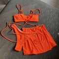 Neon orange ribbed three-piece bikini set with high-cut bottom and matching beach skirt - Orange