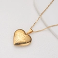Gold heart locket necklace engraved with You Are My Sunshine on white display - Gold Sun (You are my sunshine)