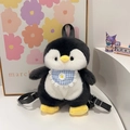 Cute black and white plush penguin backpack featuring blue plaid bib with daisy embroidery - Dark Gray