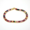 Detail of multi-color rectangular zircon stones on an 18K gold-plated tennis bracelet - Colorful