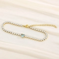 Tennis bracelet in gold finish with heart-shaped light blue stone and zircon inlay - Gold Blue Stone (KB168992-Z)