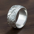 Vintage silver-colored wide band ring featuring intricate embossed vine and floral engravings - US 7