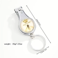 Close-up of dual-use nail clipper keychain with Queen Bee and crown vintage pattern - Queen Bee