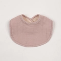 Detailed texture of cotton muslin bib with warm sherpa fleece lining in soft mauve - Dark Apricot