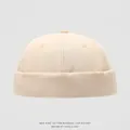 Close-up of cream cotton docker cap for kids featuring high-quality twill fabric detail - 52cm (2-5 Years) / Off White