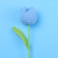 Detailed close-up of a handcrafted blue crochet tulip flower with green stem and leaf - Blue - Large Single Stem