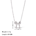 Collana con fiocco argento e zirconi bianchi con catena a croce, 40+5 cm - Oro Bianco