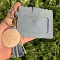 Close-up of blue faux leather card holder with tassel, gold keychain and I love you charm - Light Blue