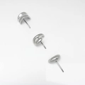 Detail view of silver metal studs including pearl arc, knot, and pebble designs - 3-Piece Stud Earring Set / Silver