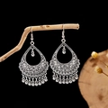 Close-up of retro silver waterdrop earrings with metal ball tassels on wooden branch - E2875-45/Teardrop Ball Tassel