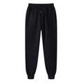Detail of black jogger pants featuring elastic drawstring waist and ribbed cuffs texture - S / Black